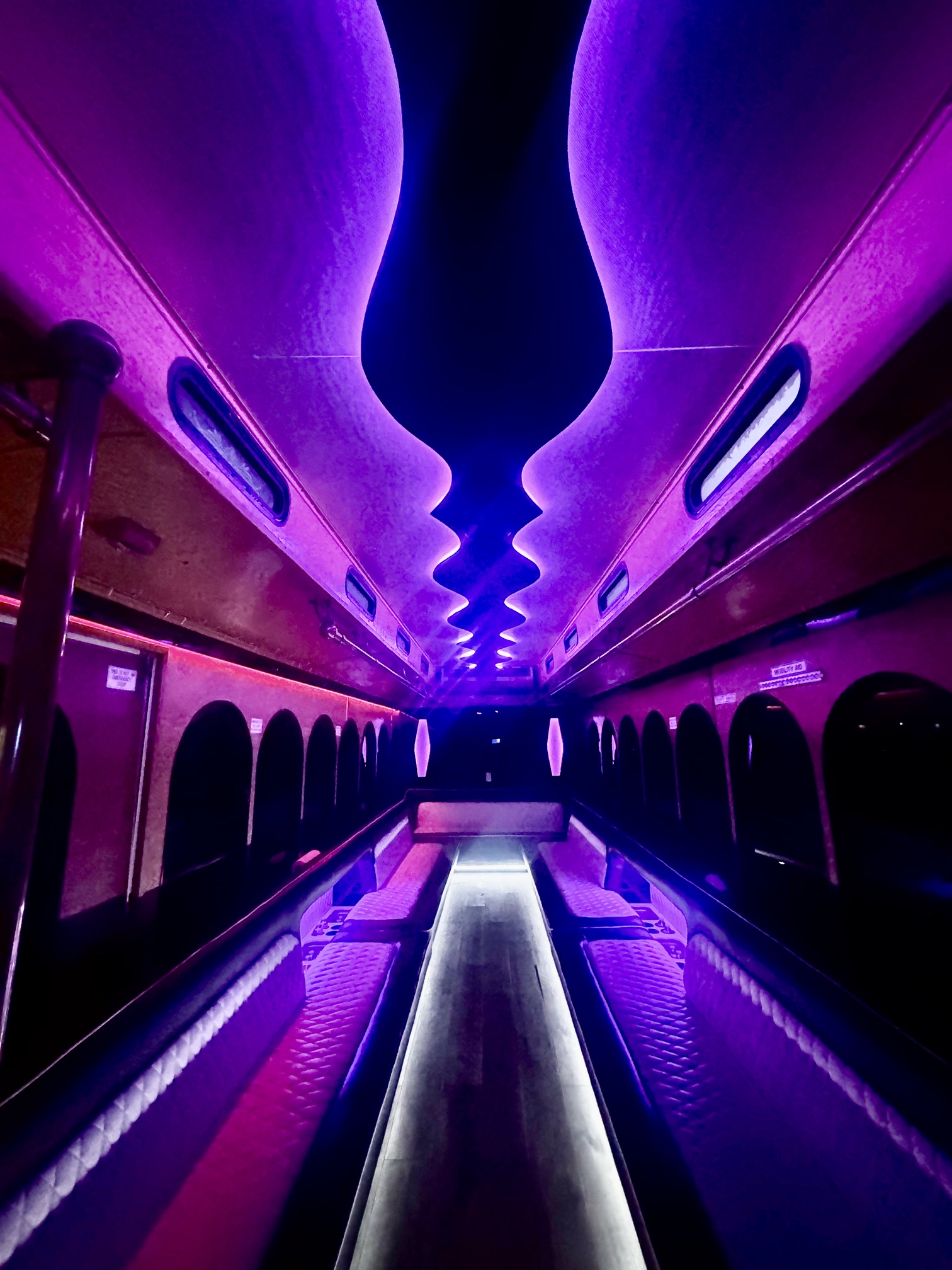 Luxury party bus interior with pink and purple LED lighting — Arlington Heights